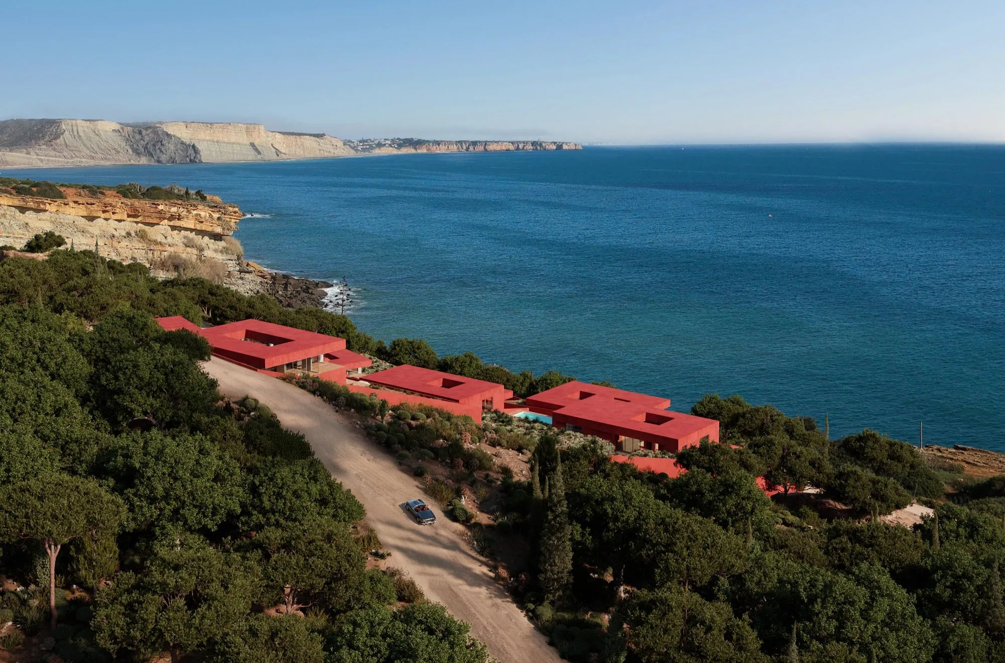 The red terraces above the coastal path and the sea