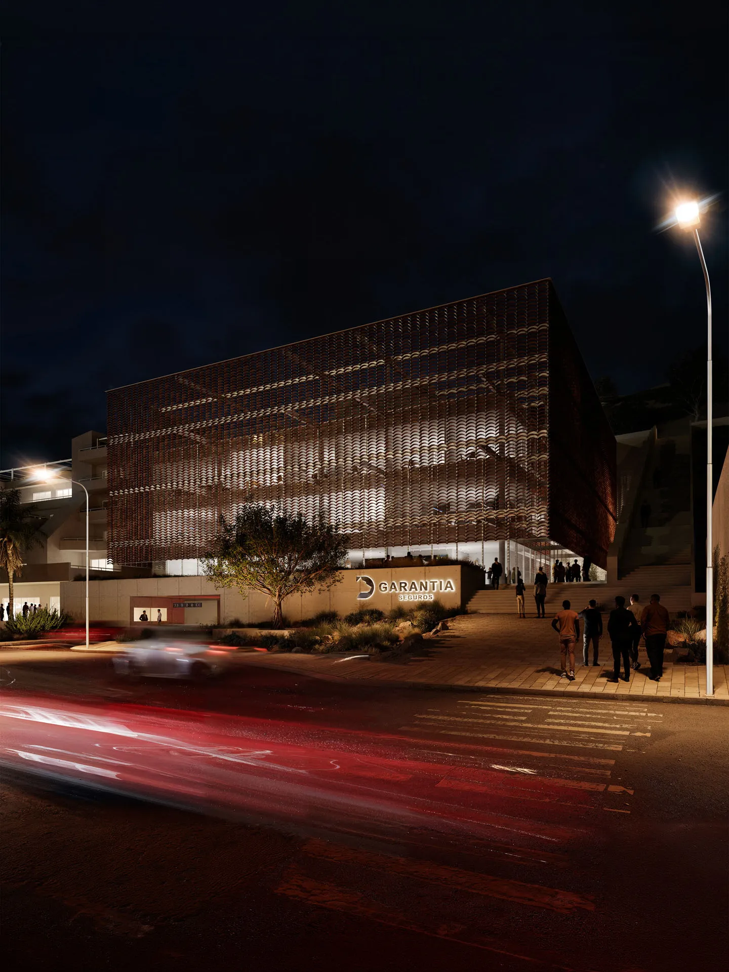 Perforated building at night with light trails