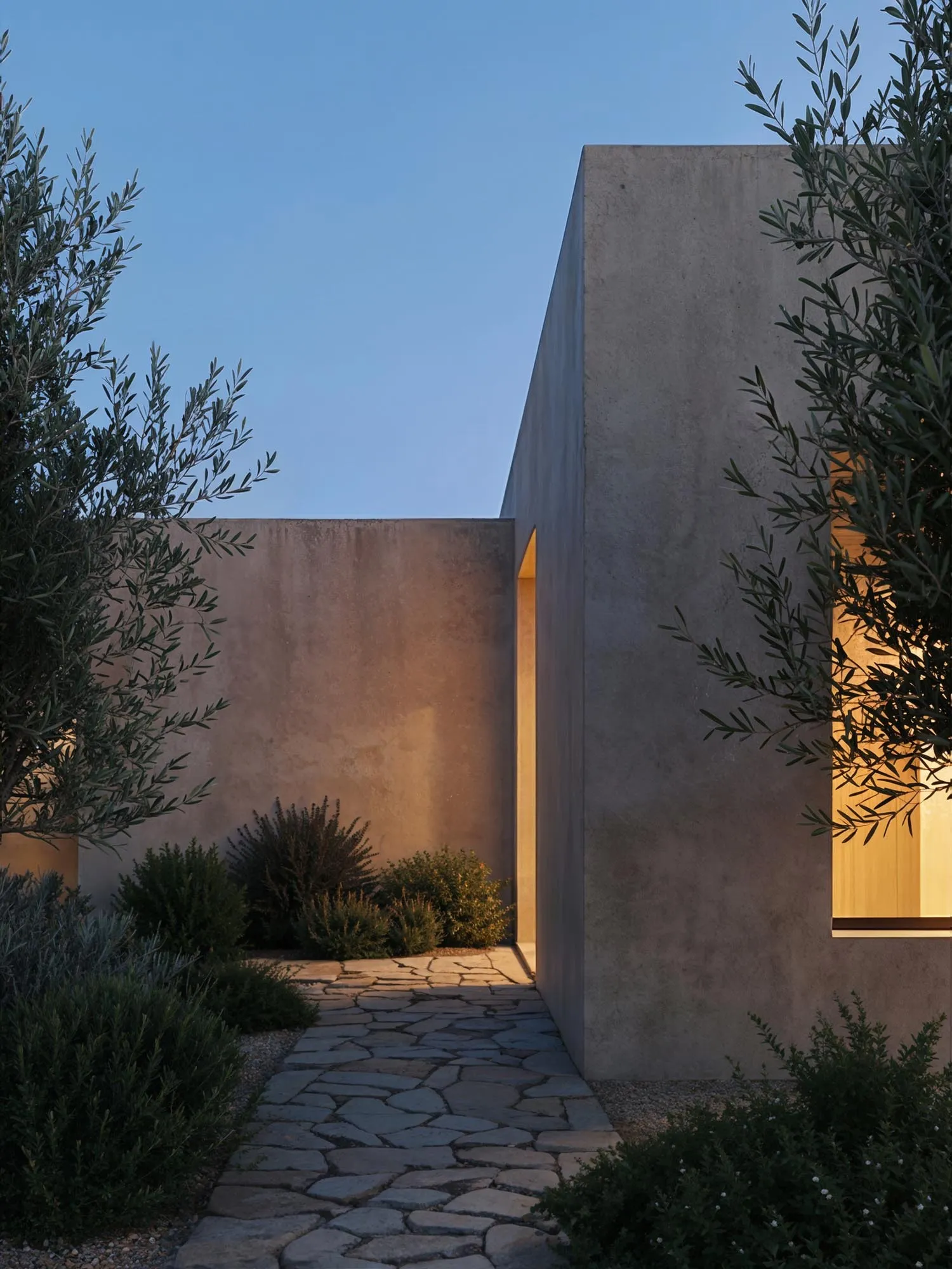 The entrance path at dusk, lit doorway